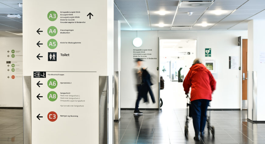 Wayfinding signage pointing towards different hospital departments