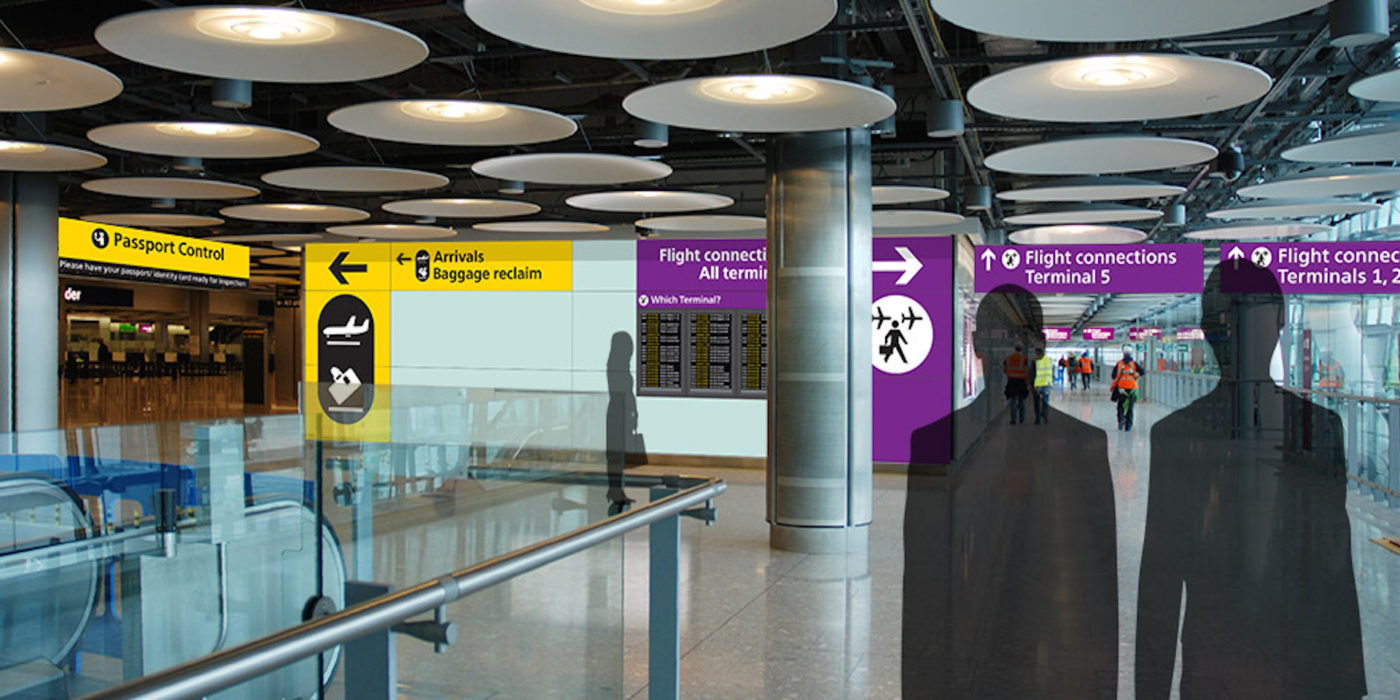 Directional signage at decision point at Heathrow Airport
