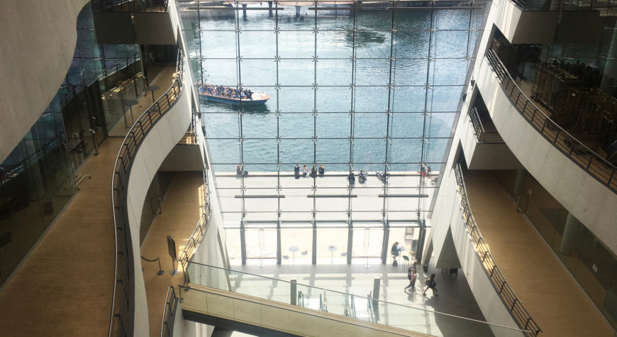 The large open space at the heart of The Black Diamond (The Royal Danish Library) with a view to several floors as well as the water